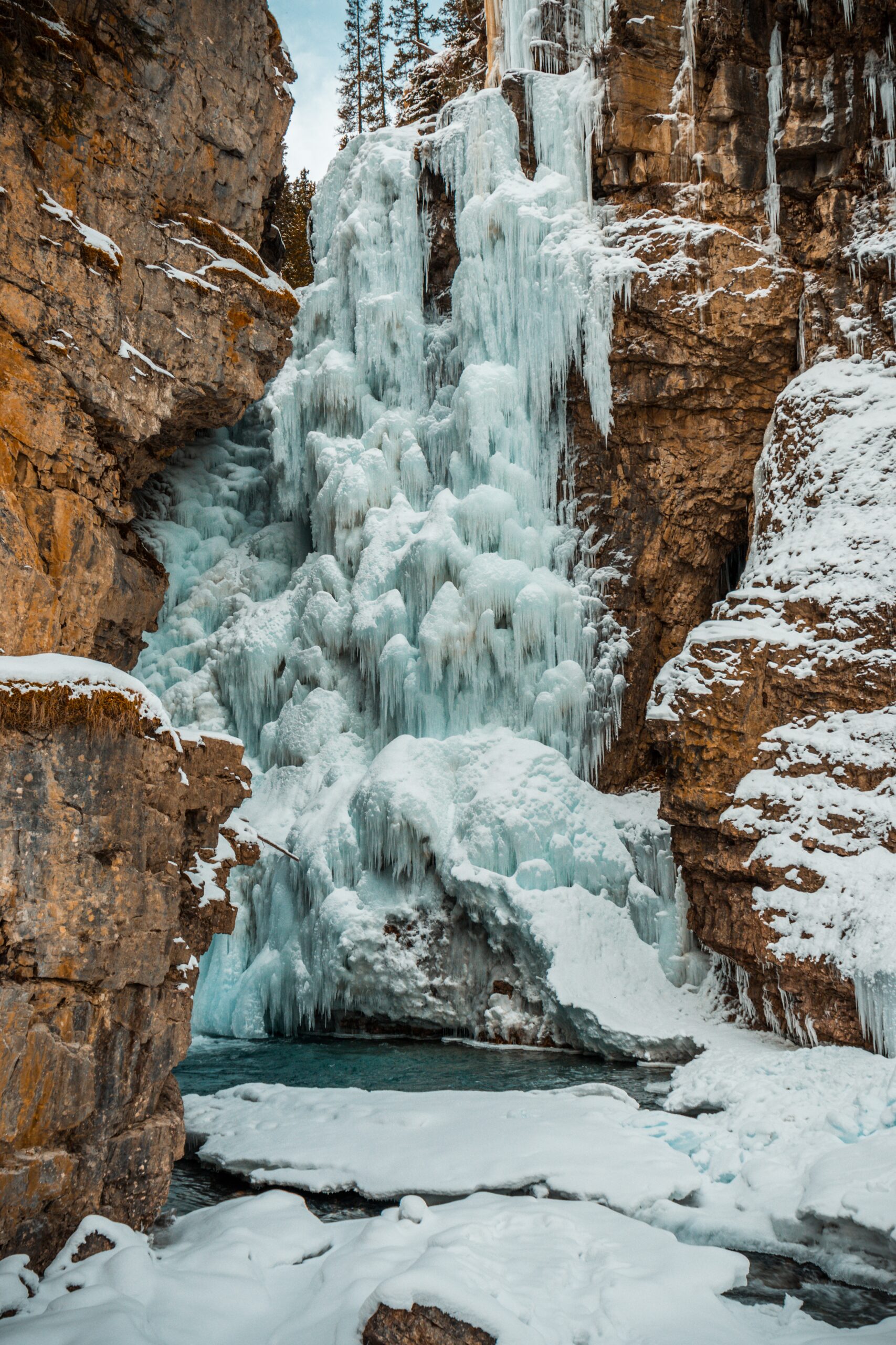 beautiful scenery of a powerful waterfall surrounded by rock formations